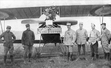 French Air ace Adolphe Pegoud, 4th from right, in front of his plane