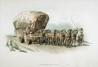 Stage wagon with wide roller wheels to give smoother passage over difficult roads and, supposedly, to damage road surface less