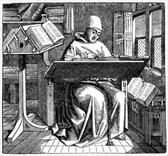 Monk at work on a manuscript in the corner of a scriptorium