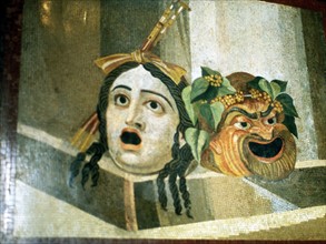 Theatrical masks of tragedy and comedy depicted in Roman mosaic