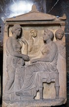 Ancient Greek relief showing friends greeting