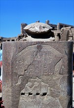 Scarab surmounting relief of a pharoah receiving tribute