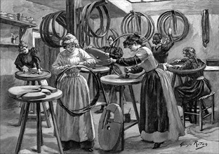Women making pneumatic tyres for bicycles: France