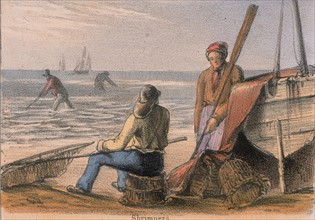 Shrimpers on the beach with their hand nets