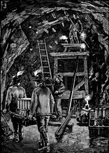 Workers in underground galleries putting cartridges of dynamite into position