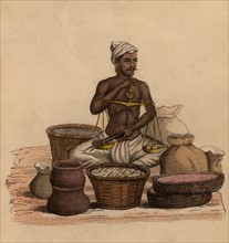 Indien pesant des ingrédients afin de préparer du bétel