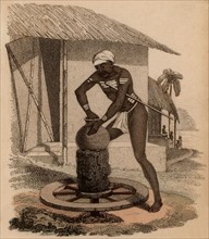 Indian potter throwing a vessel on a kick-wheel