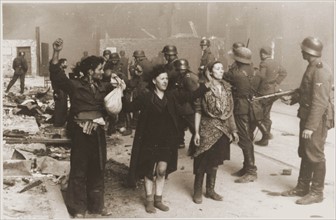 German Nazi SS troops guarding members of the Jewish resistance