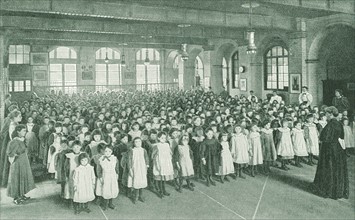 Assembly in a girls' school in the East End of London, 1910