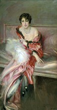 Boldini, Young woman in red in the artist's studio