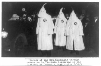 Three members of the Ku Klux Klan