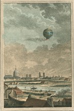 Montgolfier-style balloon in flight over Paris, France