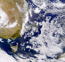 Satellite photograph of the Tasman Sea partially covered by cloud