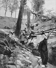 French soldiers examining a trench damaged by enemy action
