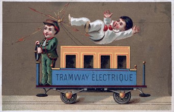 Children playing with toy electric tramway