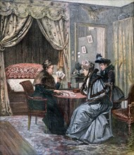 Two fashionable women having their fortunes told as read in the cards