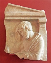 Grave relief depicting a man in sorrow