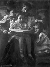 Woman and children reading