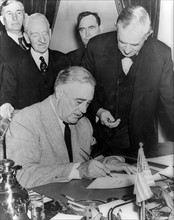 President Roosevelt signing the declaration of war