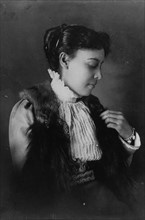 African American woman, half-length portrait, seated