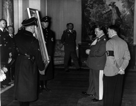 Hermann Göring shows a confiscated painting to Adolf Hitler