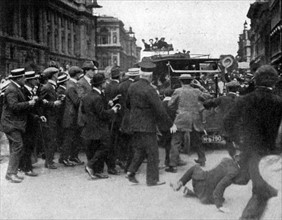 Cheering crowd surrounding the car of Mr Asquith