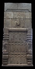 cast of Xerxes  sitting on a throne holding a sceptre and lotus flower
