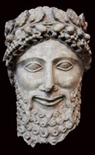 Limestone head of a statue of a bearded worshipper