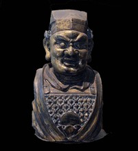 Gilt bronze head of a Buddhist guardian figure.  Yuan dynasty /  14th century AD.  Fierce armoured