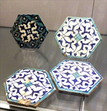 Four hexagonal ceramic tiles
