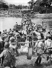 Allied Troops cross the Mogaung river in Burma