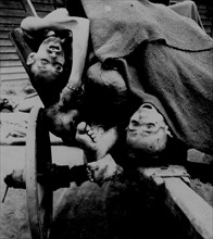 Bodies being removed by German civilians for burial