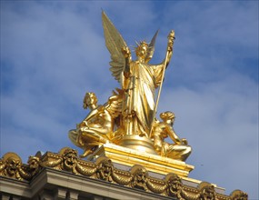 Gilded figure on the top front facade of the Opera Garnier