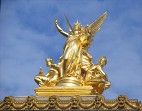 Gilded figure on the top front facade of the Opera Garnier