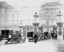 Convoy of motorised ambulances organised by the British Red Cross arriving at Buckingham Palace,