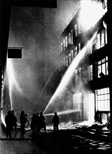 Firemen fighting a blazing City