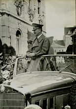 Adolf Hitler driven through a German city in an open Mercedes  c1936