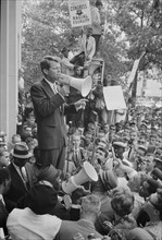 Photograph showing Attorney General Robert F Kennedy speaking to a crowd of African Americans