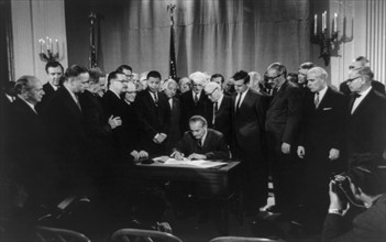 Lyndon Baines Johnson signing Civil Rights Bill