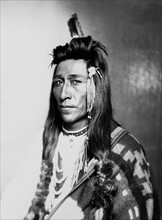 Half-length portrait of male Indian in native dress