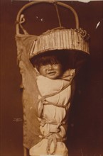 An Apache infant in cradleboard