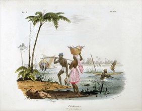 Fishermen using canoes and nets in a river