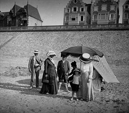 A French family group gathers on a beach in France