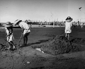 young French children play on a beach