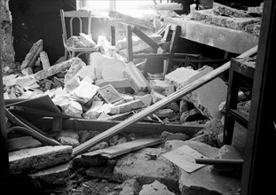 Debris after bomb explosion in an Arab Café 1939.