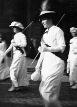 Women duting a suffrage procession