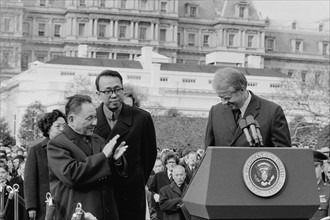 Chinese Vice Premier Deng Xiaoping applauds as US President Jimmy Carter, 1979