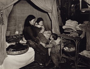 Chinese mother with two young children, 1946