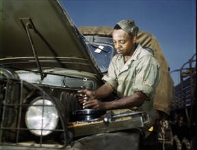 African American mechanic, in the army motor maintenance section at Ft. Knox, Kentucky, USA.