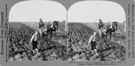 Russian farmers with a primitive native plough, c.1900